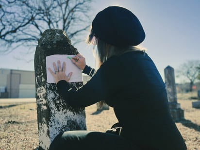 Custom Gravestone Artist Doing a Texture Impression